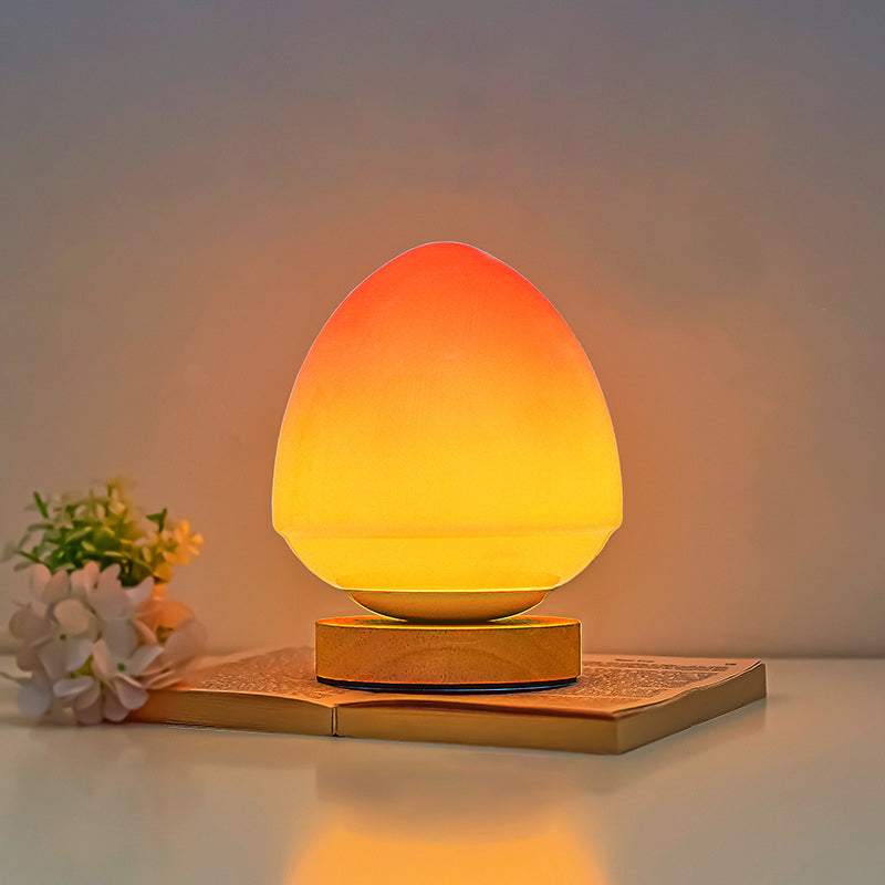 MöniGlow – Peach-Colored LED Table Lamp with Wooden Base and USB Charging Function
