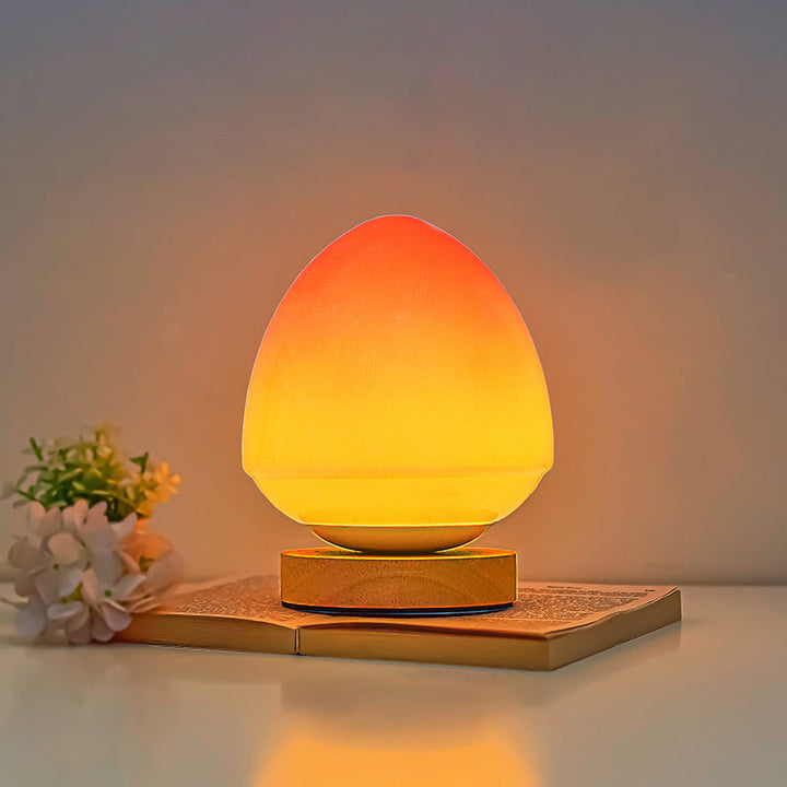 MöniGlow – Peach-Colored LED Table Lamp with Wooden Base and USB Charging Function