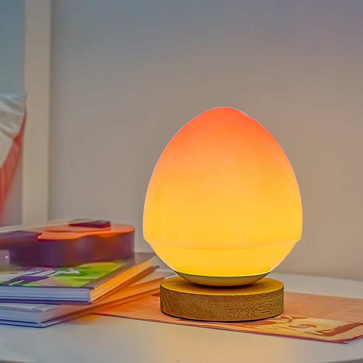 MöniGlow – Peach-Colored LED Table Lamp with Wooden Base and USB Charging Function