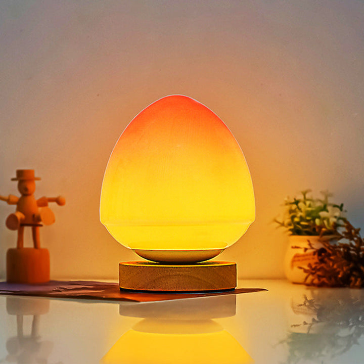 MöniGlow – Peach-Colored LED Table Lamp with Wooden Base and USB Charging Function