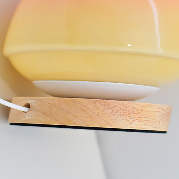 MöniGlow – Peach-Colored LED Table Lamp with Wooden Base and USB Charging Function
