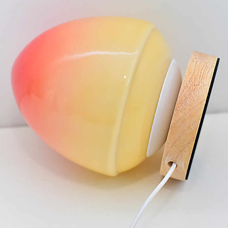 MöniGlow – Peach-Colored LED Table Lamp with Wooden Base and USB Charging Function