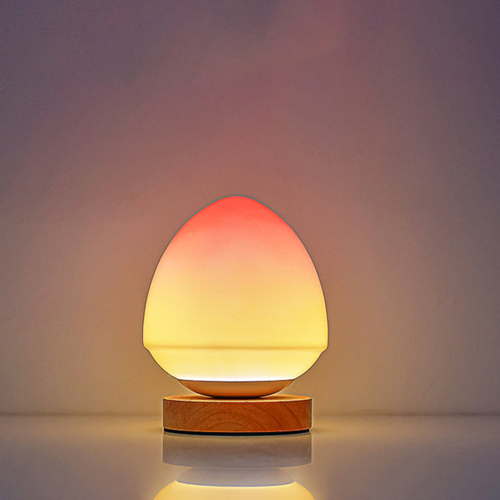 MöniGlow – Peach-Colored LED Table Lamp with Wooden Base and USB Charging Function